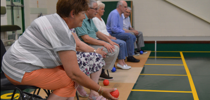 Group of people playing bowls
